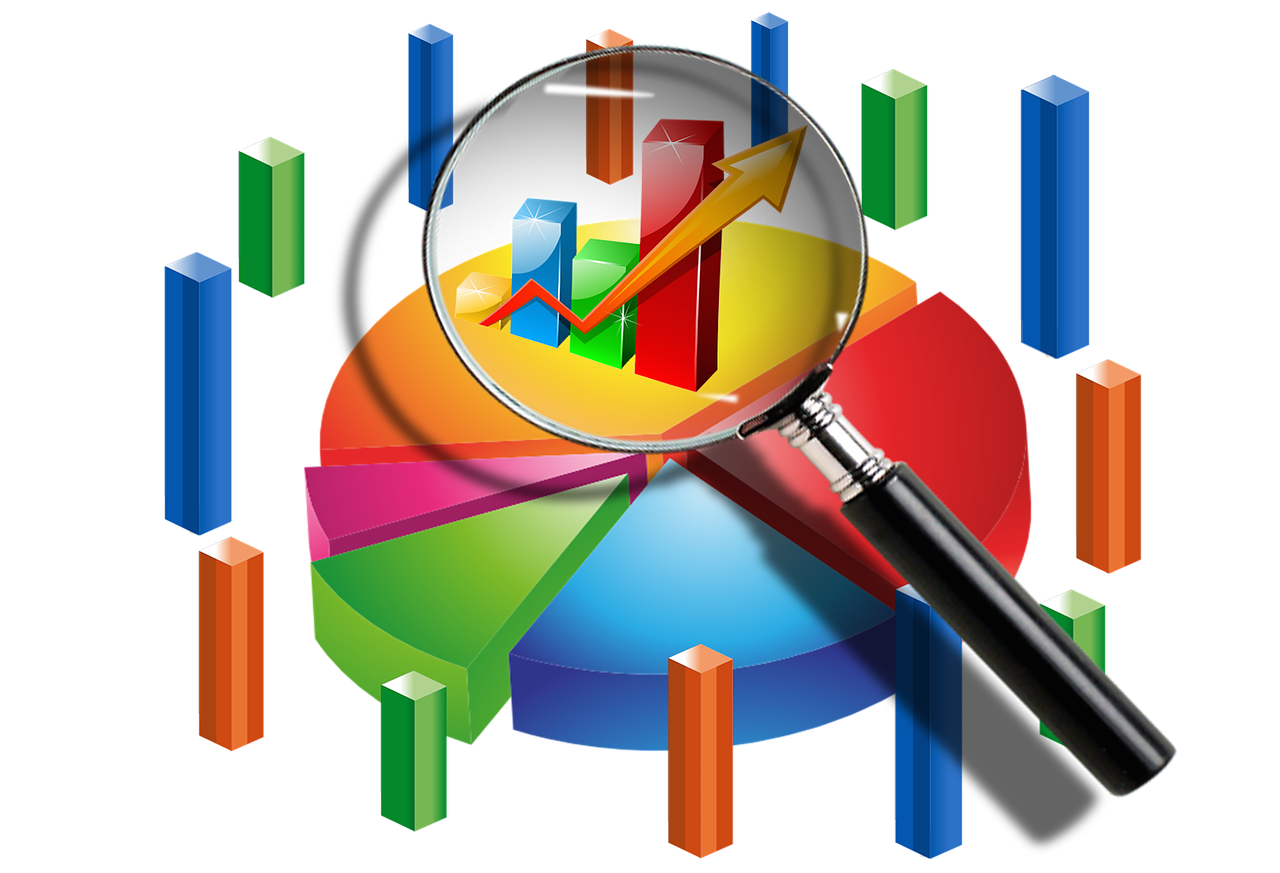 decorative image containing magnifying glass and charts 