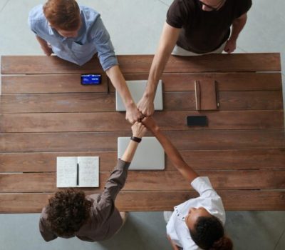 AMO-Team-fist-bump-525x445